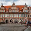 a large building with people walking in front of it