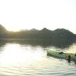 a couple of people in a boat in the water