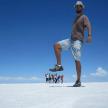 a man standing on top of a snow covered field