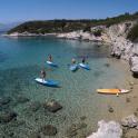 a group of people on paddle boards in the water