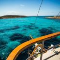 a view of the ocean from the bow of a boat