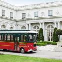 a red bus parked in front of a building