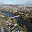 an aerial view of a river with a bridge