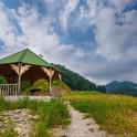 a gazebo in the middle of a field
