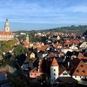 a view of a town with a river and buildings