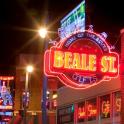a neon sign for a beale street lit up at night