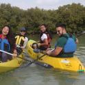 a group of people in a kayak on the water