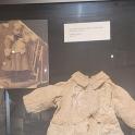 a exhibit in a glass case with a shirt on display