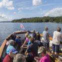 a group of people on a boat on the water