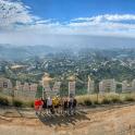 a group of people standing on top of a hill