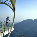 a man standing on the edge of a viewing deck