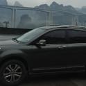 a black suv parked in a parking lot