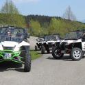 a group of three atvs and a couple of atvs