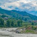 a view of a river with mountains in the background