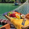 a plate of food on a boat on the water