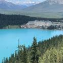 a view of a large blue lake with mountains