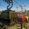 two gondolas on a ski lift in the mountains