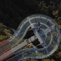 an overhead view of a curvy road with people on it