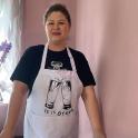 a woman wearing an apron that says it is great