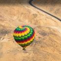 a colorful hot air balloon sitting on the ground