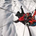 a man on skis in the snow on a mountain