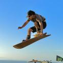a man doing a trick on a skateboard in the air