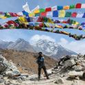 a man standing on top of a mountain with a parachute