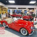 a group of vintage cars on display in a store