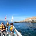 a group of people on a boat in the water