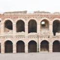 a large brick building with many arches on it