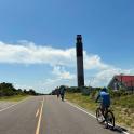 a group of people riding bikes down a road