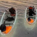 two boats in the water on the beach