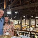 a man and a woman standing in a grocery store