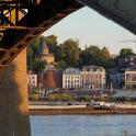 a view of a city from under a bridge