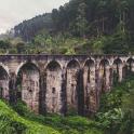 a bridge with many arches on a mountain
