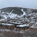 a town is covered in snow on a mountain