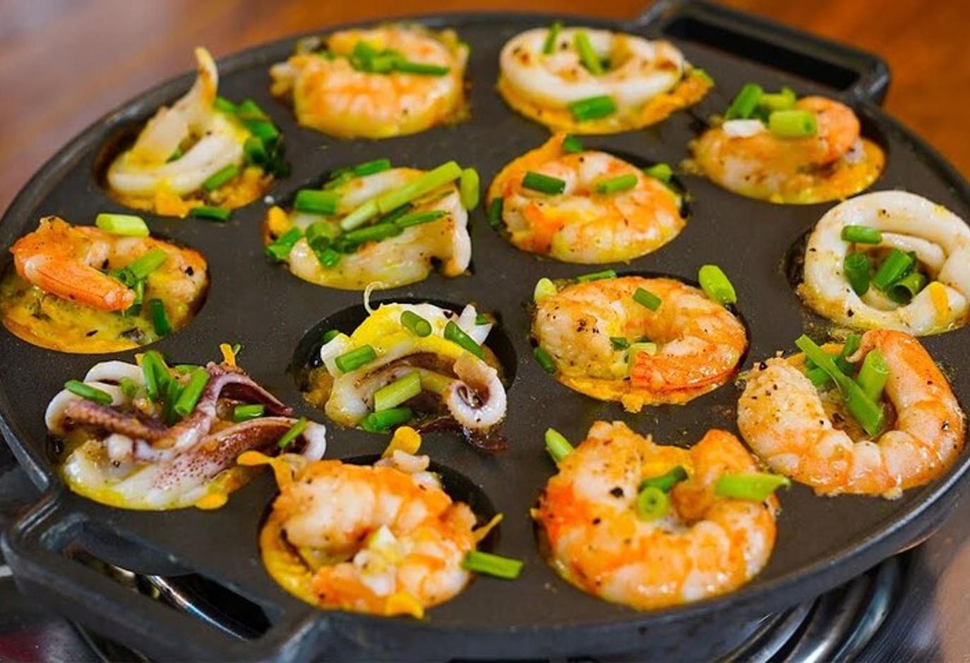 a tray of food with shrimp and vegetables on it