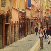 a group of people walking down a street