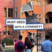 a man holding a sign that reads must sees with a konymus ii