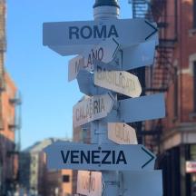 a street sign with street signs on a pole
