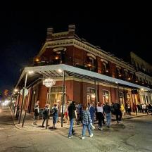 a group of people standing outside of a building
