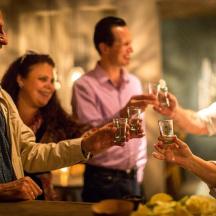 a group of people holding up glasses of wine