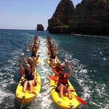 a group of people on kayaks in the water