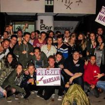 a group of people posing for a picture with signs