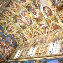 a building with a bunch of paintings on the ceiling