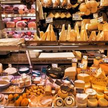 a store filled with lots of different types of cheese