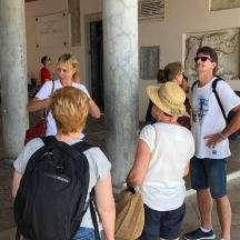 a group of people standing outside of a building