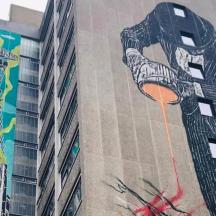 a painting of a kite on the side of a building