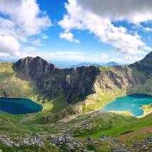 a view of two lakes on a mountain