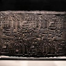 a stone relief on display on a table